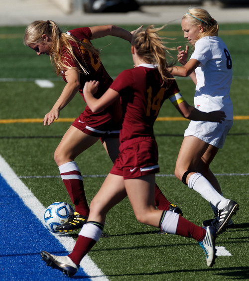 Trent Nelson  |  The Salt Lake Tribune
Mountain View's Nicole Smith makes a save as Timpanogos's Devri Hartle runs in. Mountain View faces Timpanogos High School in a 4A girls state soccer semifinal match, Tuesday October 22, 2013.