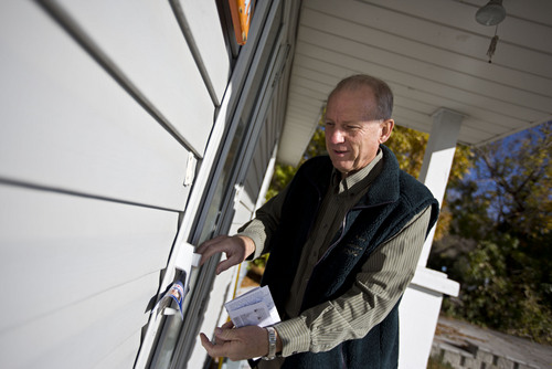 Lennie Mahler  |  The Salt Lake Tribune
West Valley City mayoral candidate Ron Bigelow leaves a flier on a door as he canvasses a neighborhood door-to-door Thursday, Oct. 17, 2013.