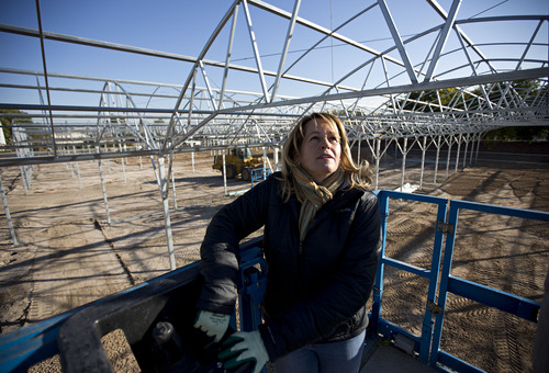 Lennie Mahler  |  The Salt Lake Tribune
West Valley City mayoral candidate Karen Lang raises the scissor lift at the construction site of an expansion to the family-owned Oakbridge Greenhouse on Friday morning Oct. 18, 2013.