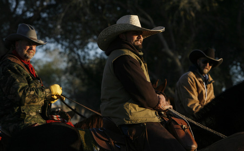 Francisco Kjolseth  |  The Salt Lake Tribune
Kyle Loveland, of Riverton, sports the biggest hat of the day while riding his "big black mule" named Malone as he joins other riders for Antelope Island's 26th annual bison roundup on Friday, October 26, 2012.