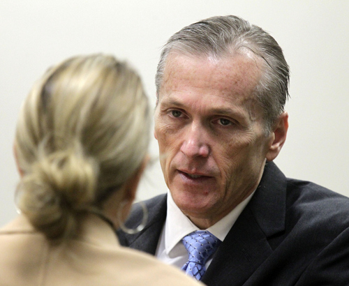 Al Hartmann  |  The Salt Lake Tribune
Pleasant Grove physician Martin MacNeill, charged with murder for allegedly killing his wife Michele MacNeill in 2007, talks with his defense lawyer Susanne Gustin in 4th District Court in Provo, Utah, October 24, 2013.