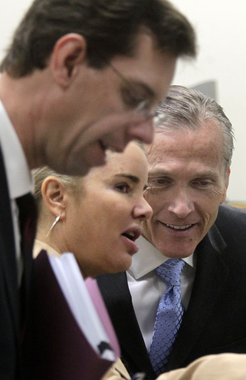 Al Hartmann  |  The Salt Lake Tribune
Pleasant Grove physician Martin MacNeill, right, charged with murder for allegedly killing his wife, Michele MacNeill in 2007, huddles with his defense lawyers Susanne Gustin and Randy Spencer in 4th District Court in Provo, Utah, October 24, 2013.