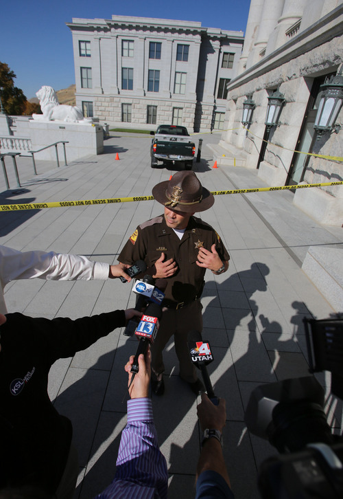 Francisco Kjolseth  |  The Salt Lake Tribune
UHP Captain Barton Blair discusses an incident where a man reportedly was shocked with a stun gun after driving a truck up several flights of stairs to the West entrance to the Utah State Capitol on Tuesday, Oct. 22. The driver is in custody as UHP investigates the incident.