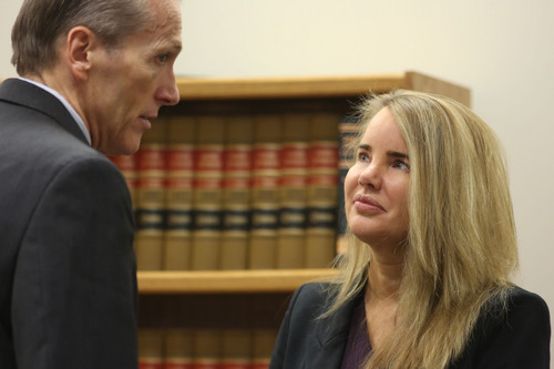 Francisco Kjolseth  |  The Salt Lake Tribune
Pleasant Grove physician Martin MacNeill, charged with murder for allegedly killing his wife, Michele MacNeill in 2007 so he could continue and extramarital affair, speaks with his attorney Susanne Gustin in Judge Derek Pullan's 4th District Court in Provo on Friday, Oct. 25, 2013.