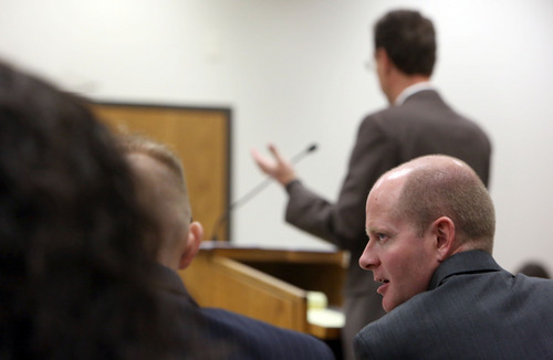 Francisco Kjolseth  |  The Salt Lake Tribune
Utah County Prosecutor Chad Grunander speaks with fellow prosecutors during the trial of Pleasant Grove physician Martin MacNeill, charged with murder for allegedly killing his wife, Michele MacNeill in 2007, at  Judge Derek Pullan's 4th District Court in Provo on Friday, Oct. 25, 2013.