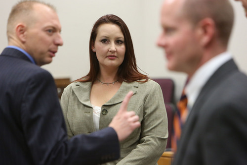 Francisco Kjolseth  |  The Salt Lake Tribune
Gypsy Willis, center, who was in an extramarital affair with Pleasant Grove physician Martin MacNeill, charged with murder for allegedly killing his wife, Michele MacNeill in 2007, appears in court in Judge Derek Pullan's 4th District Court in Provo on Friday, Oct. 25, 2013. Also pictured are Utah County Prosecutor Sam Pead, left, and Chad Grunander.