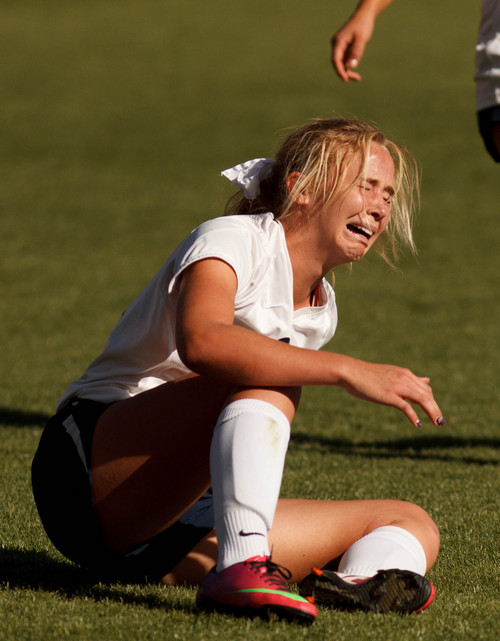Trent Nelson  |  The Salt Lake Tribune
Waterford's Caroline Coats (21) reacts to a hard fall as Waterford faces Summit Academy in the 2A high school girls' soccer state championship game at Rio Tinto Stadium in Sandy, Saturday October 26, 2013.