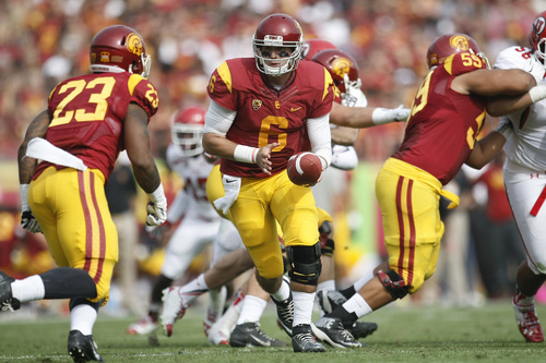 Chris Detrick  |  The Salt Lake Tribune
USC Trojans quarterback Cody Kessler (6) hands off the ball to USC Trojans running back Tre Madden (23) during the first half game at the The Los Angeles Memorial Coliseum Saturday October 26, 2013. USC is winning the game 16-3.
