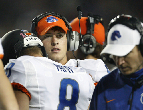 Scott Sommerdorf   |  The Salt Lake Tribune
Boise State Broncos quarterback Grant Hedrick (9) helps get his replacement, QB Nick Patti (8) ready after Hedrick was taken out of the game with about 3 minutes left.  BYU defeated Boise State 37-20, Friday, October 25, 2013.