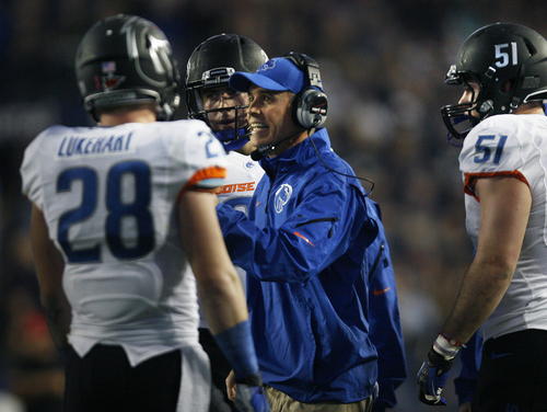 Scott Sommerdorf   |  The Salt Lake Tribune
Boise State Broncos head coach Chris Petersen talks with his team during a time out in the first half. BYU held a 24-3 lead over Boise State, Friday, October 25, 2013