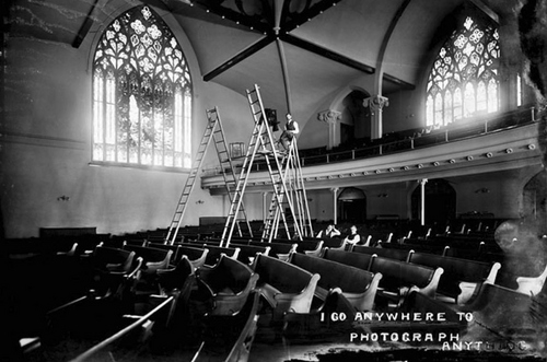 'Photo Courtesy Utah State Historical Society

Salt Lake photographer Harry Shipler on a ladder photographing the interior of the First Presbyterian Church in 1906. The Shipler family dominated photography in Utah for about 100 years. James Shipler left his Pittsburgh camera shop in 1889 to relocate in Salt Lake City. With his death in 1937, his son Harry succeeded him, with grandson Bill and great-grandson Hollis eventually taking their turn in the family business. About 100,000 Shipler glass-plate and film negatives survive in the archives of the Utah State Historical Society.