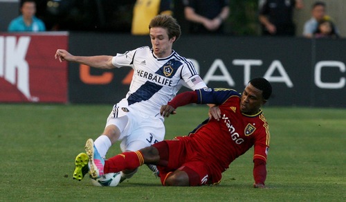 Kim Raff  |  The Salt Lake Tribune
(right) Real Salt Lake forward Robbie Findley (10) and (left) Los Angeles Galaxy defender Greg Cochrane (35) slide for a ball during the first half of a game at Rio Tinto Stadium in Salt Lake City on June 8, 2013.