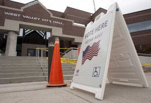 Steve Griffin  |  The Salt Lake Tribune

Early voting is underway at various City Halls and other selected community centers throughout the valley. Here, signs show that the West Valley City Hall is open for voting Monday, October 28, 2013.