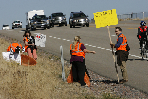 Scott Sommerdorf  |  The Salt Lake Tribune
The group Restore the Fourth (amendment) works on its first cleanup on Redwood Road in front of the new NSA Data Center on Saturday. The group adopted the road, using the cleanup as a Rally Against Mass Surveillance. Amy and Shan Morris, Lorina Potter and Dan Garfield carry signs and clean up trash on Redwood Road.