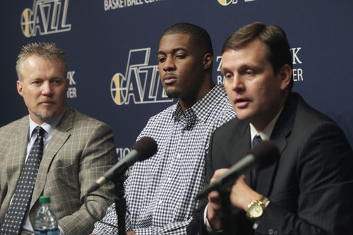 Al Hartmann  |  The Salt Lake Tribune

Dennis Lindsey, Utah Jazz general manager, announces a multi-year contract extension for power forward Derrick Favors, center, during a press conference Monday October 28, 2013 in Salt Lake City. Jazz owner, Greg Miller, is at left.