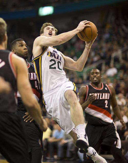 Lennie Mahler  |  The Salt Lake Tribune
Gordon Hayward drives to the basket as the Jazz face the Blazers at EnergySolutions Arena on Wednesday, Oct. 16, 2013.