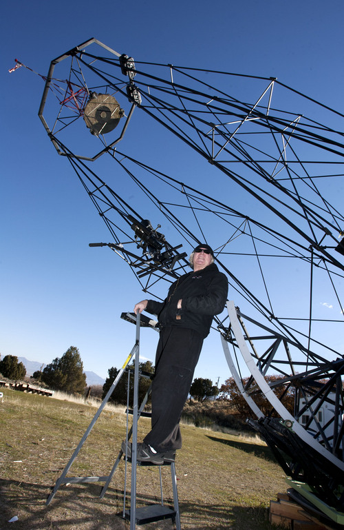 Steve Griffin  |  The Salt Lake Tribune

Mike Clements with his homemade 70-inch telescope in Herriman, Utah, Sunday, October 27, 2013. The 70-inch mirror and 35 foot length make it one of the biggest telescopes created by an amateur astronomer.