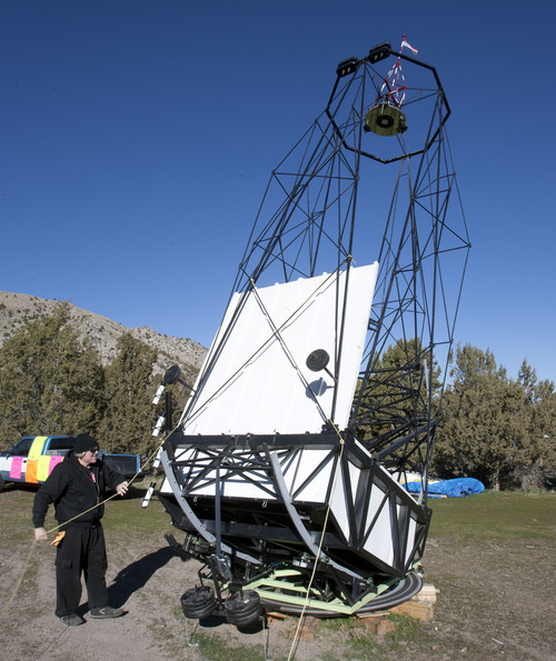 Steve Griffin  |  The Salt Lake Tribune

Mike Clements with his homemade 70-inch telescope in Herriman, Utah, Sunday, October 27, 2013. The 70-inch mirror and 35 foot length make it one of the biggest telescopes created by an amateur astronomer.