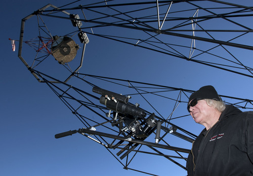 Steve Griffin  |  The Salt Lake Tribune

Mike Clements with his homemade 70-inch telescope in Herriman, Utah, Sunday, October 27, 2013. The 70-inch mirror and 35 foot length make it one of the biggest telescopes created by an amateur astronomer.