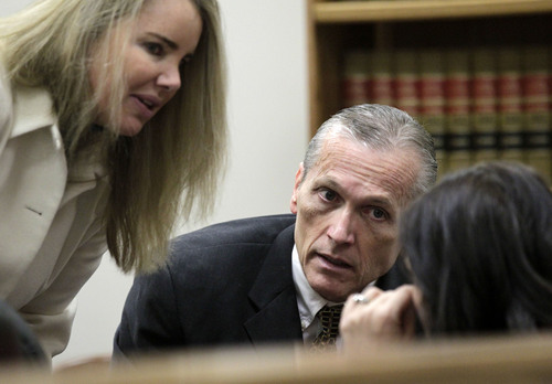 Al Hartmann  |  The Salt Lake Tribune
Pleasant Grove physician Martin MacNeill, charged with murder for allegedly killing his wife, Michele MacNeill, in 2007 talks with his defense lawyer Susanne Gustin in Judge Derek Pullan's 4th District Court in Provo, Utah, Thursday, Oct. 31, 2013.