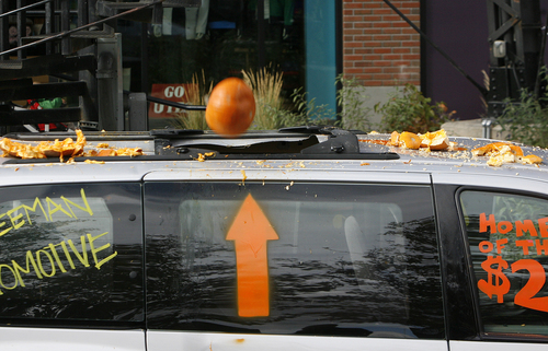 Scott Sommerdorf   |  The Salt Lake Tribune
A pumpkin speeds its way inside a donated mini-van that was the target at the Trolley Square pumpkin drop, Thursday, October 31, 2013. A local radio station sponsored a contest where 25 contestants dropped Halloween pumpkins off Trolley Square's Water Tower, aiming for a car's sunroof some 80 feet below. Contestants dressed in their Halloween best and later joined in for a multi-pumpkin grand finale.