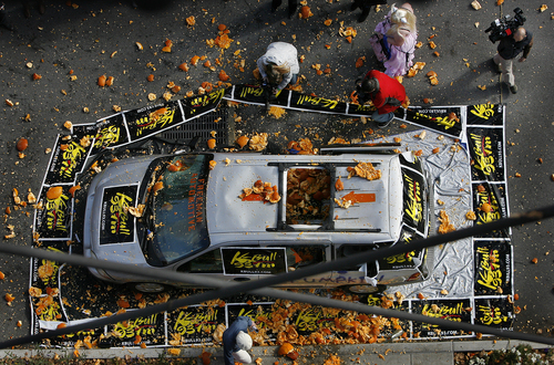 Scott Sommerdorf   |  The Salt Lake Tribune
The target at the dumpkin drop. A local radio station sponsored a contest where 25 contestants dropped Halloween pumpkins off Trolley Square's Water Tower, aiming for a car's open sunroof some 80 feet below. Contestants dressed in their Halloween best and later joined in for a multi-pumpkin grand finale, Thursday, October 31, 2013.