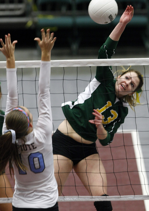 Chris Detrick  |  The Salt Lake Tribune
St. Joseph's Jessica Bischof spikes the ball past Piute's Paige Jessen during the 1A volleyball championships at UCCU Center at Utah Valley University Thursday October 31, 2013.
