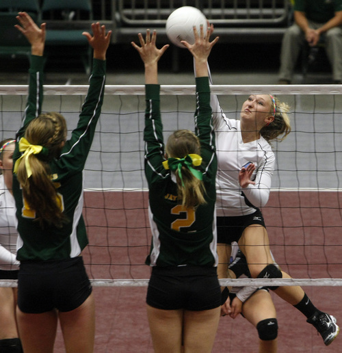 Chris Detrick  |  The Salt Lake Tribune
St. Joseph's Audra Thurston and Danielle Shinaut block Piute's Shaylee Gleave during the 1A volleyball championships at UCCU Center at Utah Valley University Thursday October 31, 2013.