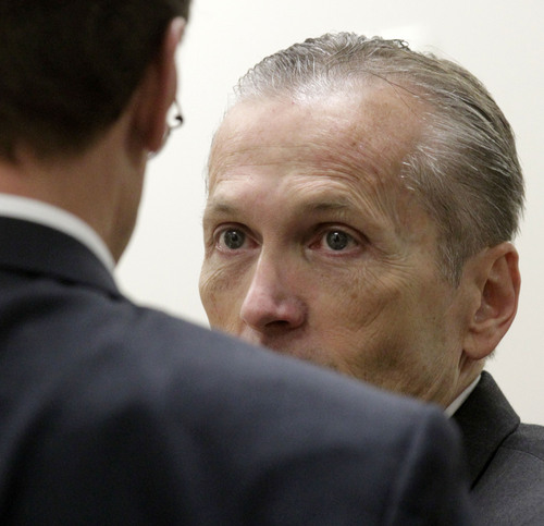 Al Hartmann  |  The Salt Lake Tribune
Pleasant Grove physician Martin MacNeill, charged with murder for allegedly killing his wife, Michele MacNeill, in 2007 speaks with his defense lawyer Randy Spencer in Judge Derek Pullan's 4th District Court in Provo, Utah, Friday, Nov. 1, 2013.