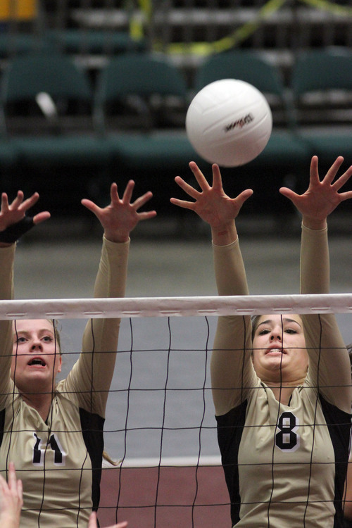 Francisco Kjolseth  |  The Salt Lake Tribune
Alexa Goulding, left, and Lauren Kamalu of Desert Hills compete against Payson in the 3A state quarterfinal volleyball matches at Utah Valley University UCCU Center on Friday, Nov. 1, 2013.