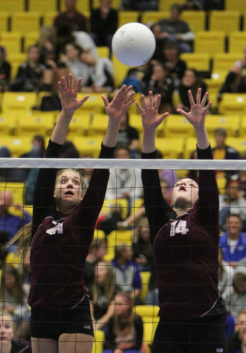 Francisco Kjolseth  |  The Salt Lake Tribune
Jessica Carter, left, and Mckenzie Schenk of Morgan rise up in defense against Stansbury in the 3A state quarterfinal volleyball matches at Utah Valley University UCCU Center on Friday, Nov. 1, 2013.