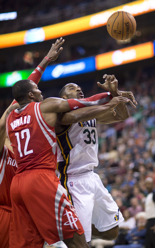 Lennie Mahler  |  The Salt Lake Tribune
Jazz forward Mike Harris draws a foul from Rockets center Dwight Howard in the first half of a game against the Houston Rockets on Saturday, Nov. 2, 2013, at EnergySolutions Arena in Salt Lake City.