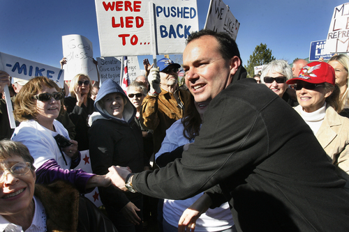 Scott Sommerdorf   |  The Salt Lake Tribune
Sen. Mike Lee works his way through the crowd that gathered for a rally in his support in South Jordan on Saturday.