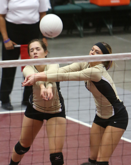 Francisco Kjolseth  |  The Salt Lake Tribune
Lauren Kamalu, left, and Blair Bliss of Desert Hills go for the ball together against Payson in the 3A state quarterfinal volleyball matches at Utah Valley University UCCU Center on Friday, Nov. 1, 2013.