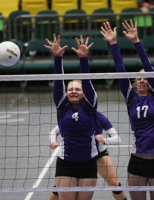 Francisco Kjolseth  |  The Salt Lake Tribune
Kassidie Russell, left, and Annie Dalton of Toole brace for impact against Hurricane in the 3A state quarterfinal volleyball matches at Utah Valley University UCCU Center on Friday, Nov. 1, 2013.