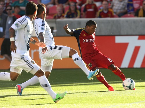 Kim Raff  |  The Salt Lake Tribune
(right) Real Salt Lake forward Joao Plata (8) passes the ball past (middle) Los Angeles Galaxy defender Sean Franklin (5) during the first half of a game at Rio Tinto Stadium in Salt Lake City on June 8, 2013.