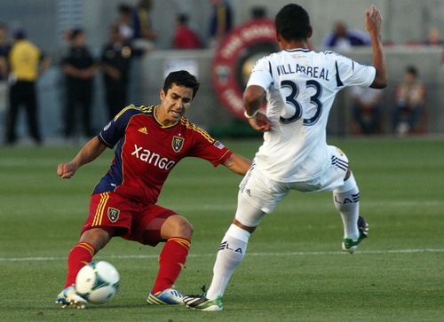 Kim Raff  |  The Salt Lake Tribune
(left) Real Salt Lake defender Tony Beltran (2) looks to pass the ball past (right) Los Angeles Galaxy midfielder Jose Villarreal (33) during a game at Rio Tinto Stadium in Salt Lake City on June 8, 2013.  Real went on to win the game 3-1.