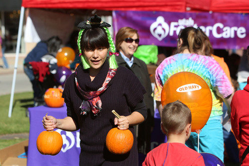 Francisco Kjolseth  |  The Salt Lake Tribune
Brandi Sweet, the newly appointed American Indian foster family recruiter for Utah Foster Care, attends the organization's 12th Annual Pumpkin Festival at the Gateway Mall on Friday, Oct. 18, 2013.