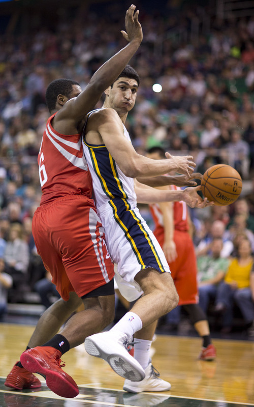 Lennie Mahler  |  The Salt Lake Tribune
Jazz center Enes Kanter loses control of the ball as Rockets forward Terrence Jones knocks it out of bounds in the first half of a game against the Houston Rockets on Saturday, Nov. 2, 2013, at EnergySolutions Arena in Salt Lake City.