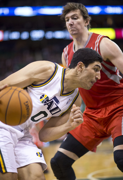 Lennie Mahler  |  The Salt Lake Tribune
Jazz center Enes Kanter drives against Rockets center Omer Asik in the first half of a game against the Houston Rockets on Saturday, Nov. 2, 2013, at EnergySolutions Arena in Salt Lake City.