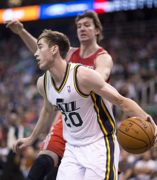 Lennie Mahler  |  The Salt Lake Tribune
Jazz guard Gordon Hayward drives past Rockets center Omer Asik in the first half of a game against the Houston Rockets on Saturday, Nov. 2, 2013, at EnergySolutions Arena in Salt Lake City.