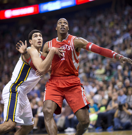 Lennie Mahler  |  The Salt Lake Tribune
Jazz center Enes Kanter fights for rebounding position against Rockets center Dwight Howard in the first half of a game against the Houston Rockets on Saturday, Nov. 2, 2013, at EnergySolutions Arena in Salt Lake City.