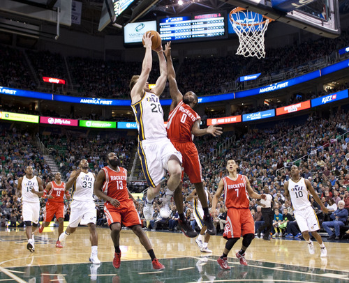 Lennie Mahler  |  The Salt Lake Tribune
Jazz guard Gordon Hayward posterizes Rockets guard Aaron Brooks in the first half of a game against the Houston Rockets on Saturday, Nov. 2, 2013, at EnergySolutions Arena in Salt Lake City.