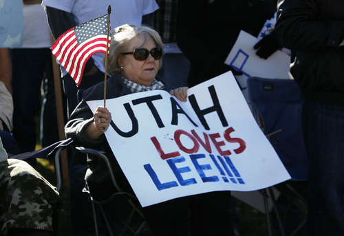 Scott Sommerdorf   |  The Salt Lake Tribune
A woman holds a supportive sign as she waits for Sen. Mike Lee to arrive at a rally where he spoke to supporters in South Jordan on Saturday, Nov. 2, 2013.