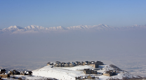 Steve Griffin | The Salt Lake Tribune


Houses in the foothills above Draper, Utah peak out of the inversion Thursday January 17, 2013.