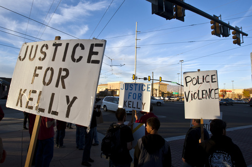 Chris Detrick  |  The Salt Lake Tribune
People participate during a "rally against police violence" outside of West Valley City Hall on the one year anniversary of Danielle Willard's death Saturday November 2, 2013. Danielle Willard was shot and killed Nov. 2, 2012 by West Valley City police during an alleged drug bust. Salt Lake County District Attorney Sim Gill determined West Valley City Detective Kevin Salmon and former Detective Shaun Cowley were not justified in using deadly force against Willard, but he has not determined whether the pair will face criminal charges for their actions.