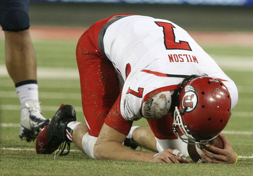 Steve Griffin  |  The Salt Lake Tribune

Utah Utes quarterback Travis Wilson (7) stays on the ground after being tackled during first half action in the University of Utah versus University of Arizona football game at Arizona Stadium in Tucson, Ariz., Saturday, October 19, 2013. WIlson did not return to the game after the play.