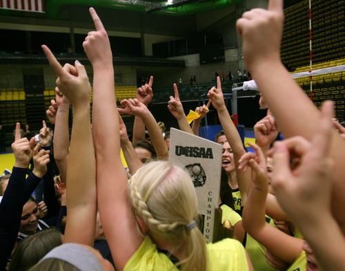 Rick Egan  | The Salt Lake Tribune 

Enterprise High School celebrates their win over San Juan High,  in the 2A volleyball State Championship game, Saturday, November 2, 2013.