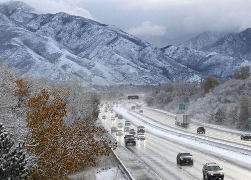 Al Hartmann  |  The Salt Lake Tribune
Morning commuters get their first taste of winter driving down I-80 at the mouth of Parleys Canyon Tuesday morning Nov. 5, 2013, after a couple of inches of snow fell overnight.