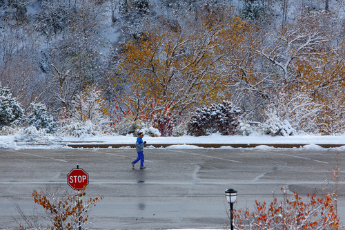Trent Nelson  |  The Salt Lake Tribune
A woman jogs in a snow-filled scene Tuesday Nov. 5, 2013, near the Capitol building in Salt Lake City. Utah's water year got off to a good start in October with soil moisture at 58 percent across Utah, up from 42 percent in October 2012.